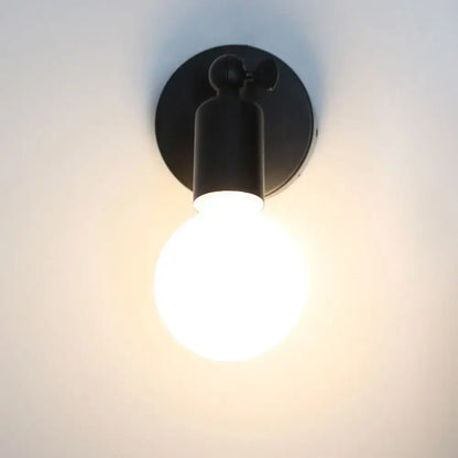 Modern black industrial-style wall lamp holder with glowing bulb for adjustable bedroom wall lamp sconce