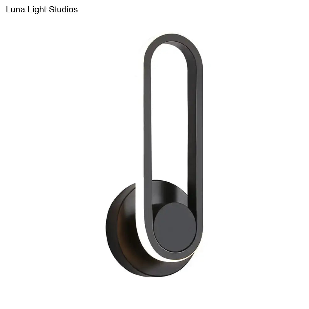 Modern black and white aluminum frame wall lamp with black matte finish and warm white light for bedroom sconce