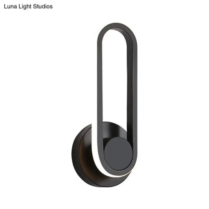 Modern black and white aluminum frame wall lamp with black matte finish and warm white light for bedroom sconce
