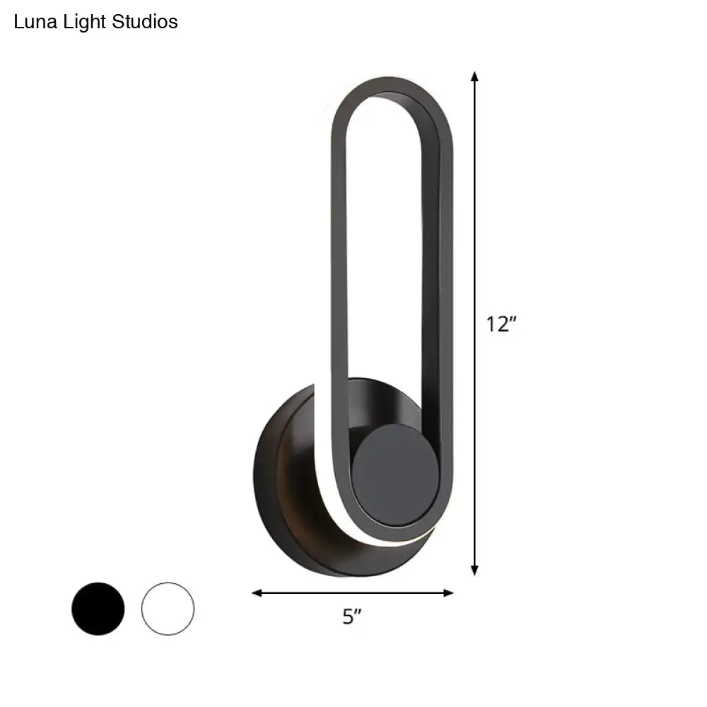 Modern black aluminum frame wall lamp with sleek minimalist design and warm white light for bedroom sconce use
