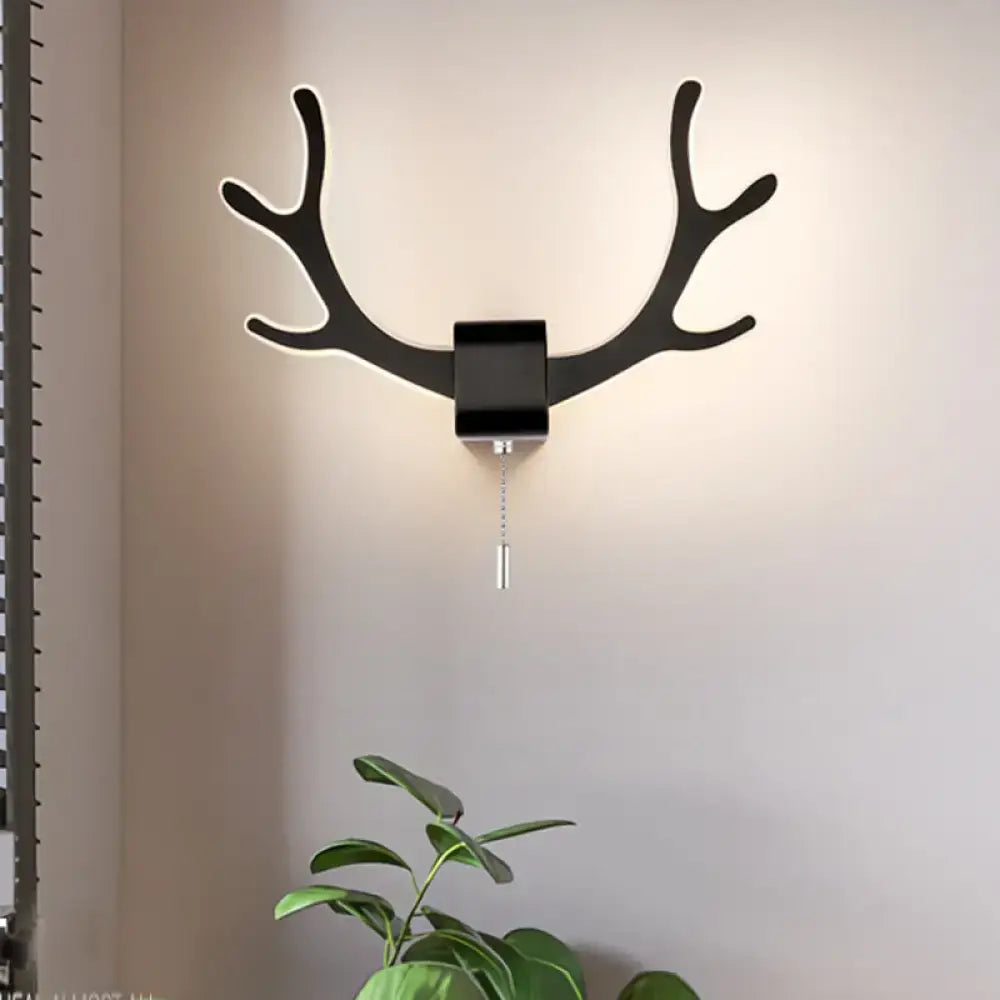 Modern black antler wall sconce with matte finish pull chain and warm white light for bedroom black white decor