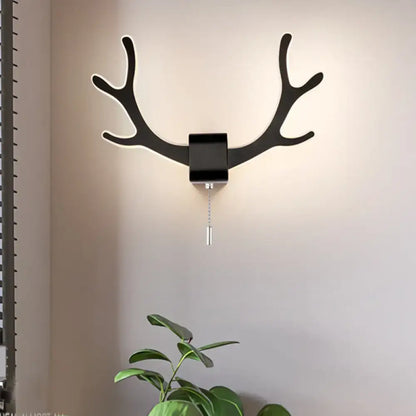 Modern black antler wall sconce with matte finish pull chain and warm white light for bedroom black white decor