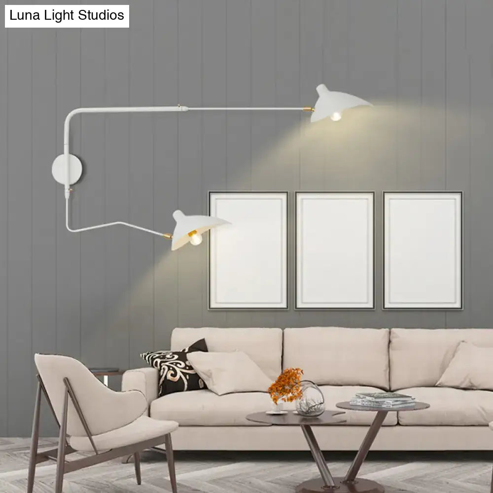 Modern black and white wall sconce light fixture with curved arms and bird-shaped shades for living room lighting