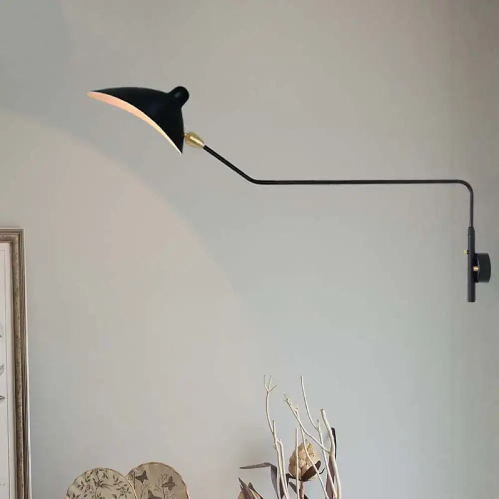 Modern black and white articulated wall sconce with curved arm and gold accents light fixture for living room