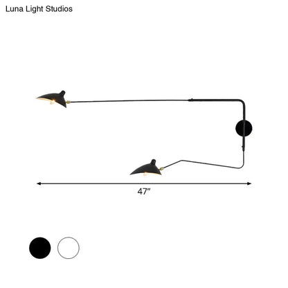 Modern black and white wall sconce light fixture with two articulated arms for living room illumination