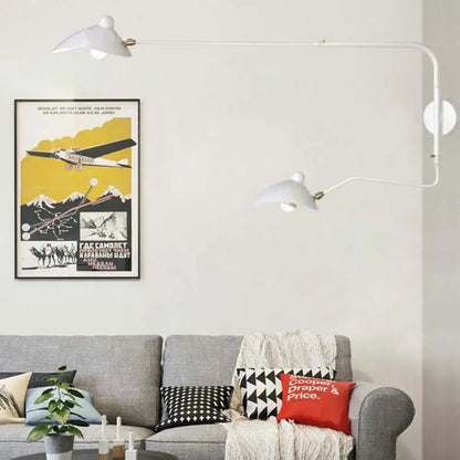 White wall sconce light fixture with adjustable arms and minimalist design for modern living room decor