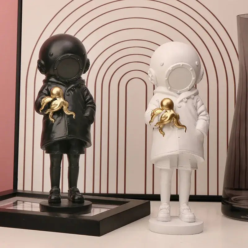 Modern black and white astronaut diver sculpture ornament holding golden octopus for office decor