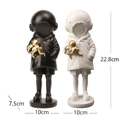 Modern black and white astronaut diver sculpture ornament holding a golden octopus for office decor