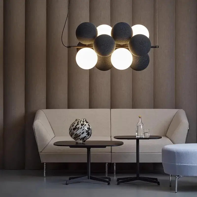 Modern black and white ball led ceiling pendant light with matte spherical bulbs on a sleek metal frame for kitchen use