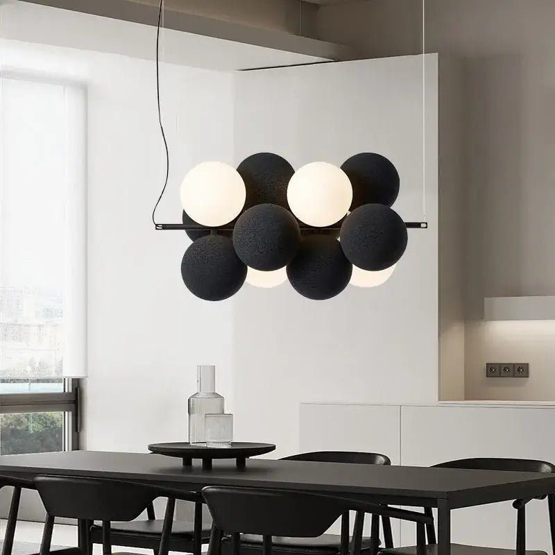 Modern black and white ball led ceiling chandelier with matte finish spherical bulbs arranged in a cluster design