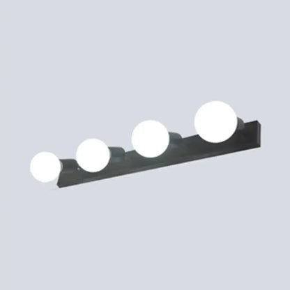 Modern black and white bedroom vanity light with exposed bulbs and four round white bulbs on a rectangular fixture