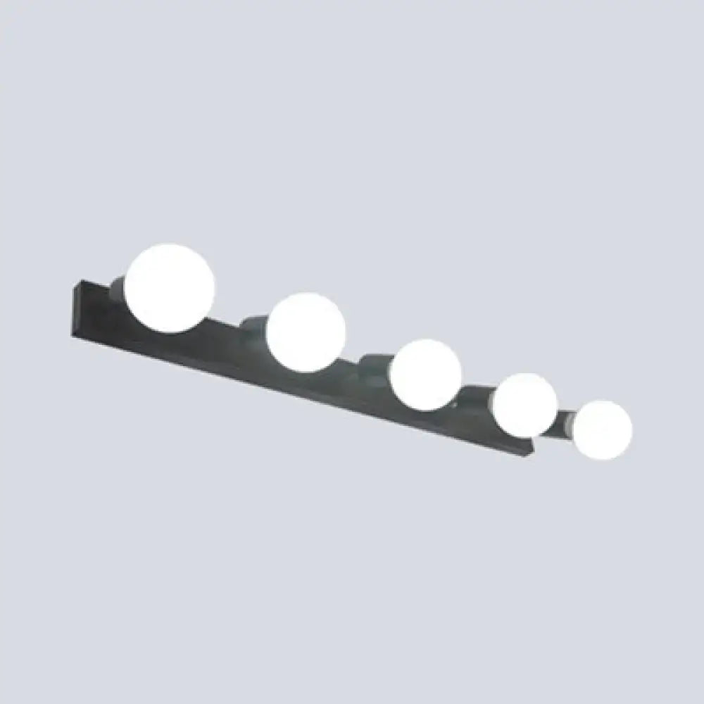 Black rectangular bedroom vanity light with five exposed white bulbs for modern black white decor