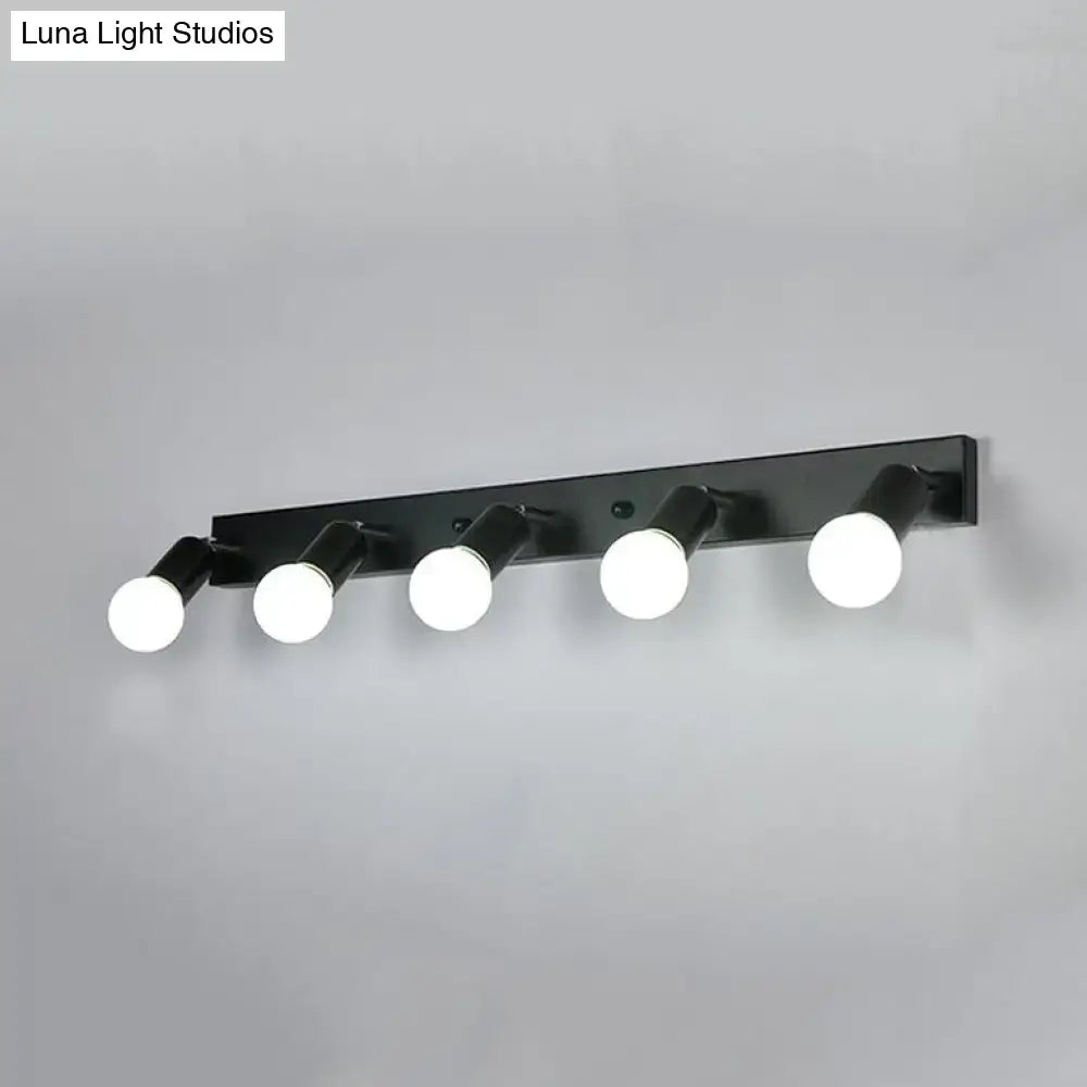 Black metal bedroom vanity light fixture with five adjustable white spherical exposed bulbs in black white design