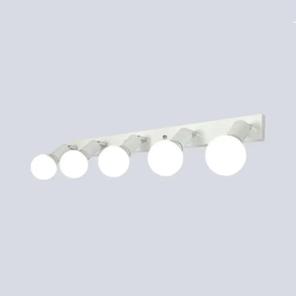 Modern black and white bedroom vanity light with five adjustable exposed bulbs mounted on white wall fixture