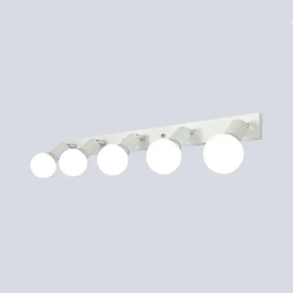 Modern black and white bedroom vanity light with five adjustable exposed bulbs mounted on white wall fixture