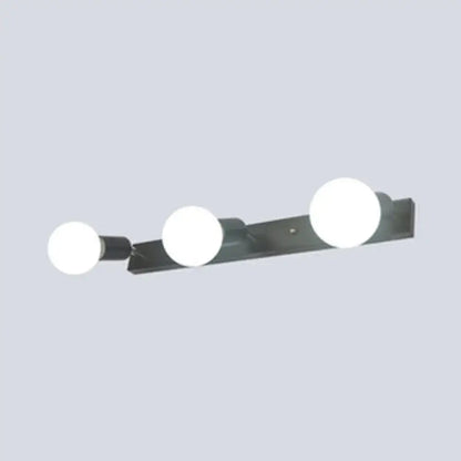 Modern black and white bedroom vanity light with exposed bulbs and three spherical white bulbs wall-mounted design
