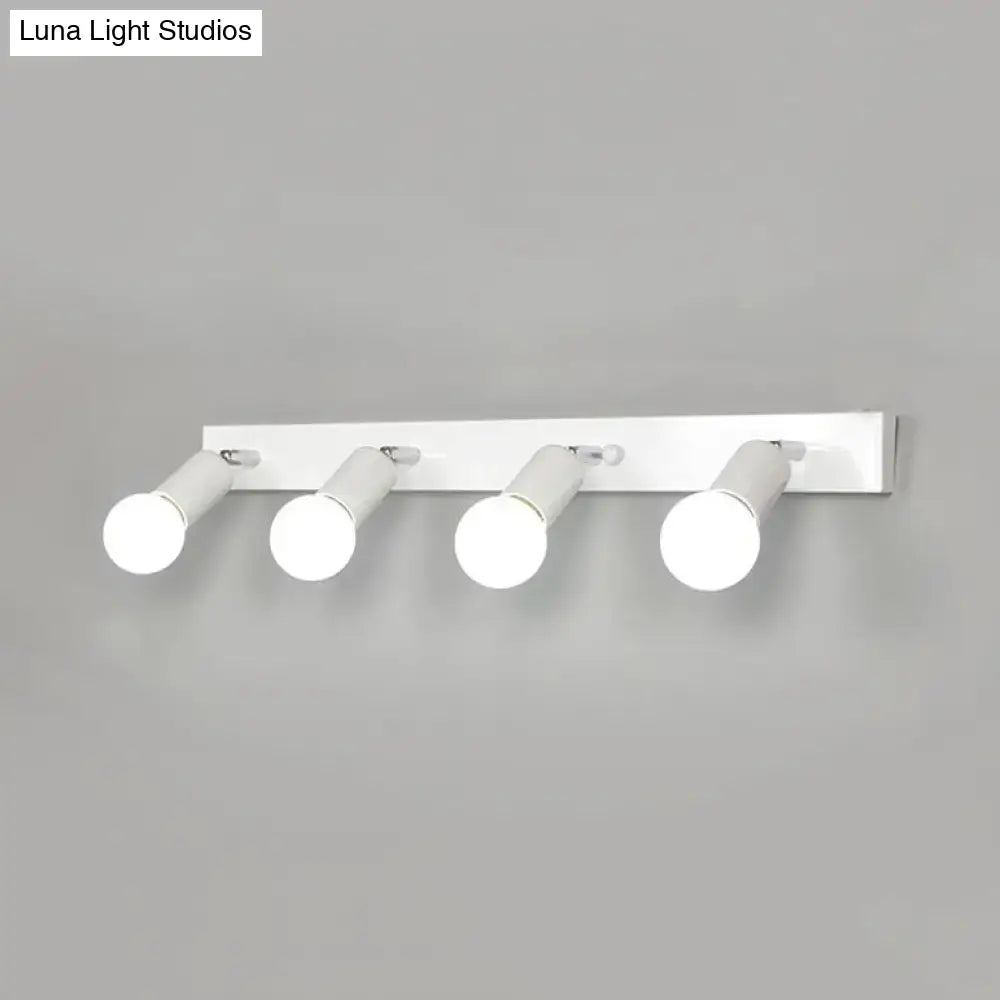 White modern wall-mounted bedroom vanity light with four adjustable exposed bulb spotlight heads in black and white