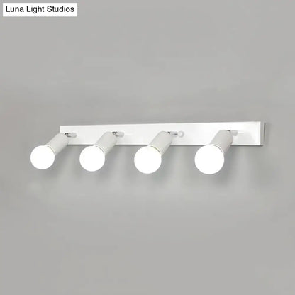 White modern wall-mounted bedroom vanity light with four adjustable exposed bulb spotlight heads in black and white