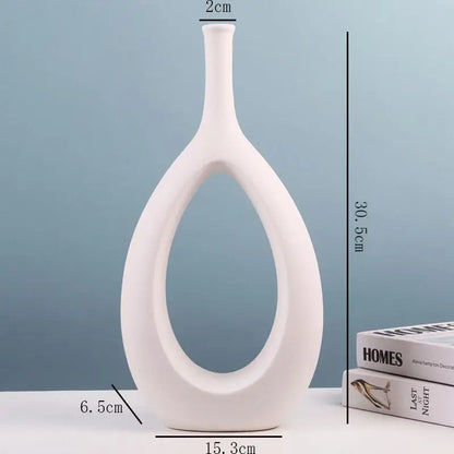 Modern black and white ceramic vase by decorbites with sleek oval cutout and slender neck for living room decor
