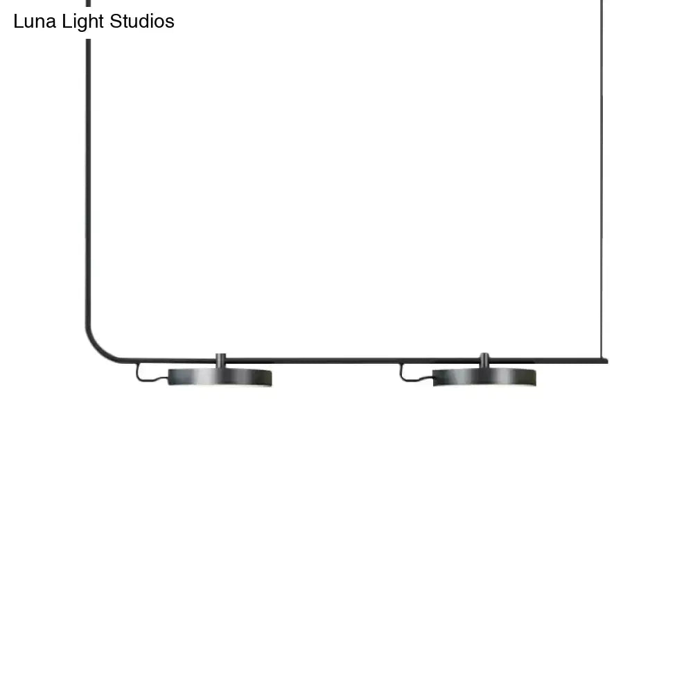 Minimalist DecorBites modern chandelier featuring black metal pendant with two circular fixtures for dining room lighting