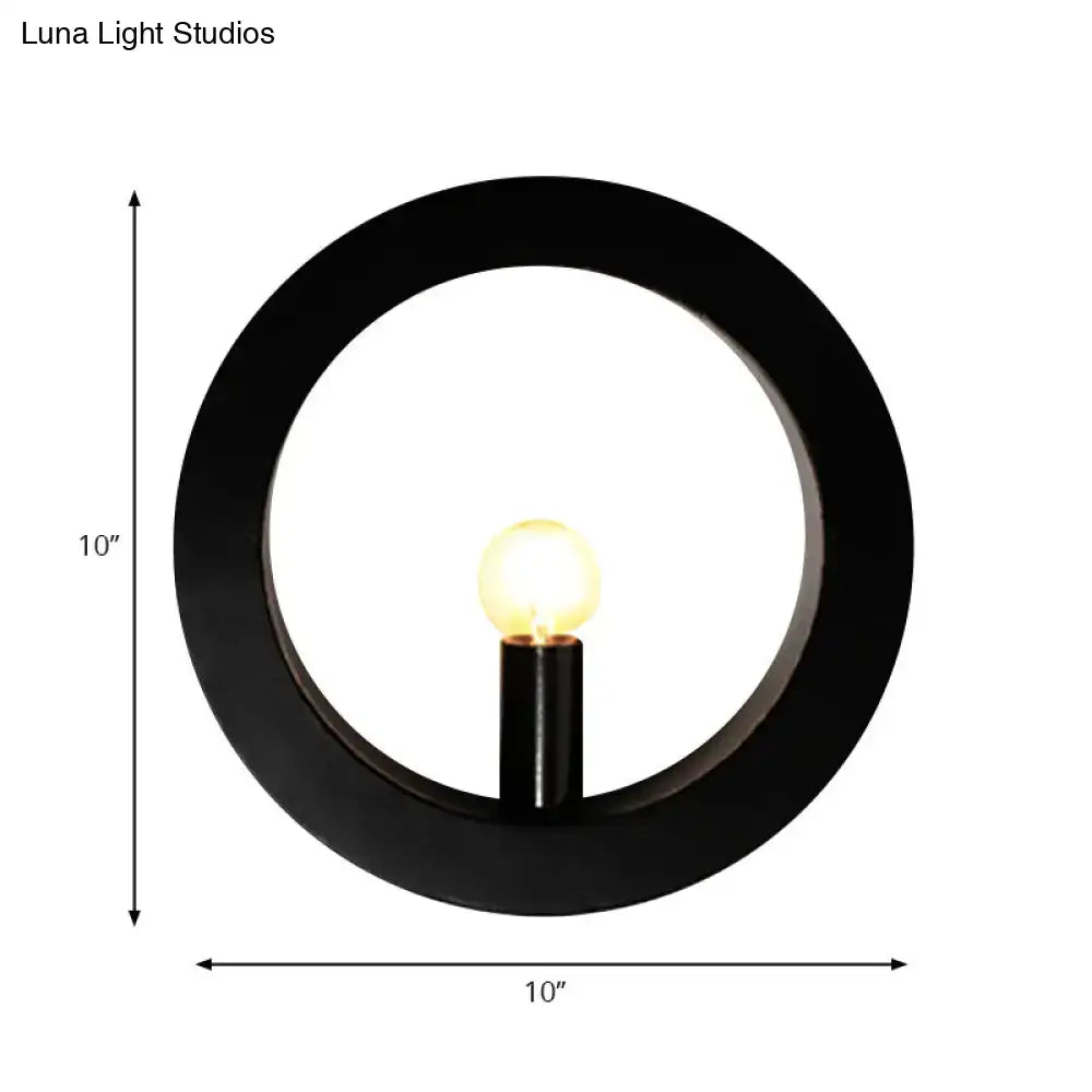 Modern black wall lamp with white circle wall frame and glowing bulb designed as a bedroom circle wall light