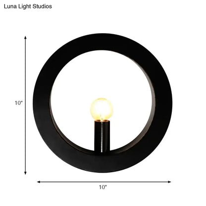 Modern black wall lamp with white circle wall frame and glowing bulb designed as a bedroom circle wall light