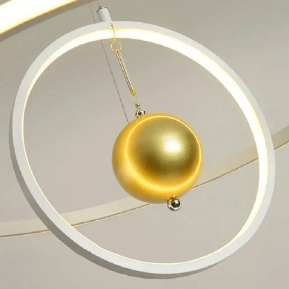 Modern black and white circular iron ball pendant light with a glowing frame and polished gold orb for living room decorbites circular iron