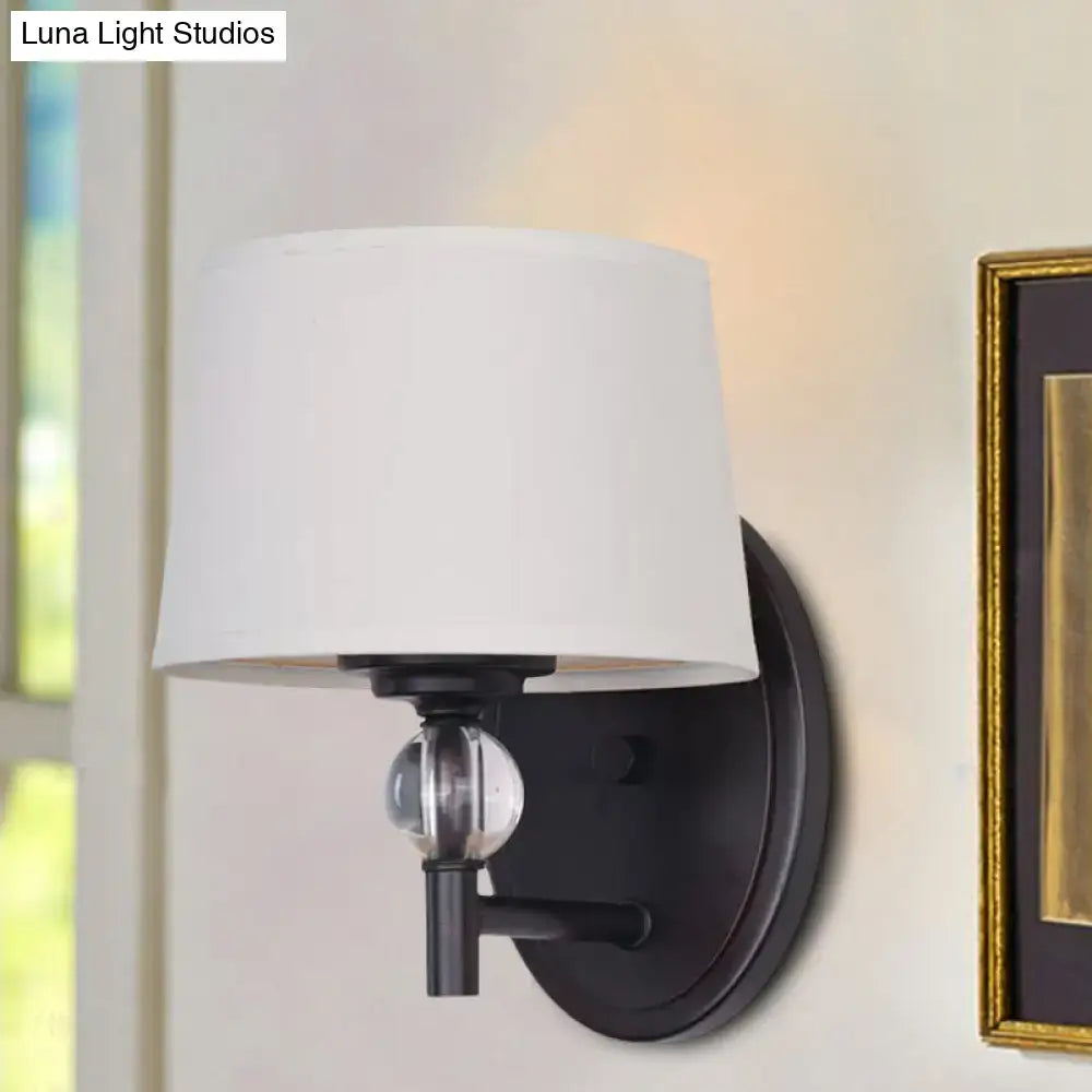 Modern black metal wall sconce with white fabric shade and crystal ball accent suitable for 110v-120v led lighting