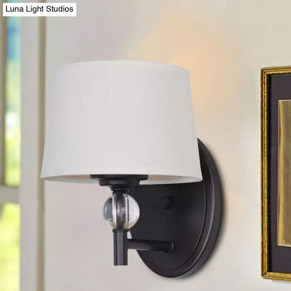 Modern black metal wall sconce with white fabric shade and crystal ball accent suitable for 110v-120v led lighting
