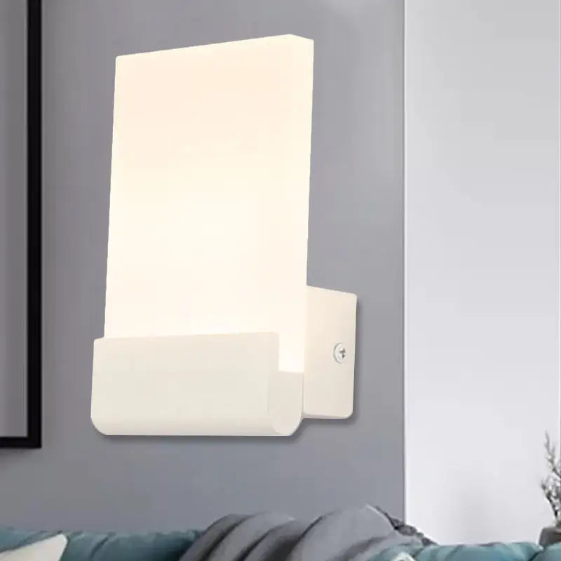 Modern black and white cuboid design led sconce with a sleek rectangular shape for bedroom wall lighting