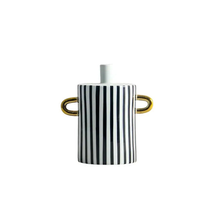 A sleek ceramic vase with black and white dots geometric stripes and gold handles for modern living room decor