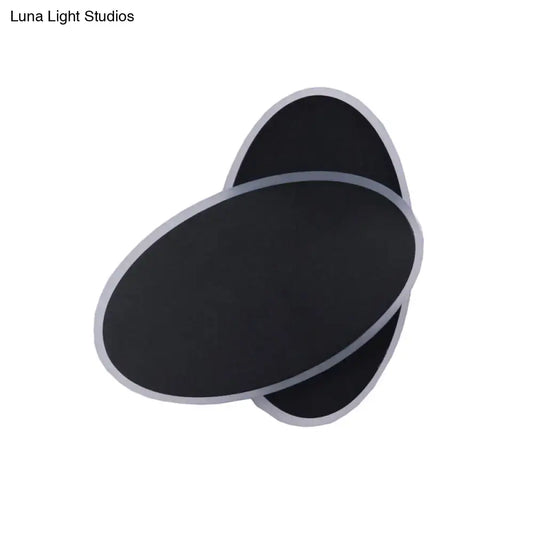 Modern black double oval wall sconce lamp with silver metallic trim for bedside bedroom lighting