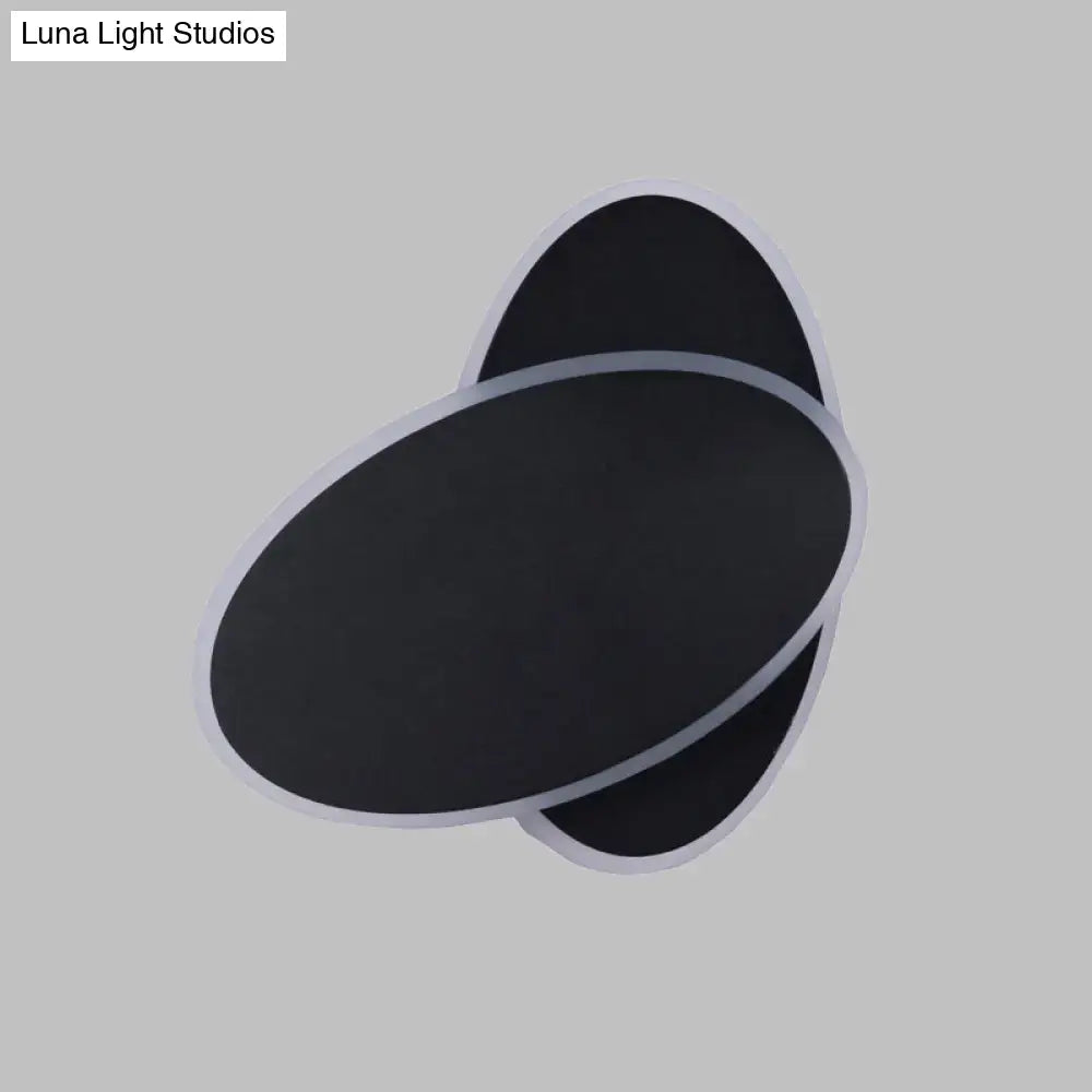 Modern black double oval wall sconce lamp with sleek silver trim for bedside bedroom lighting