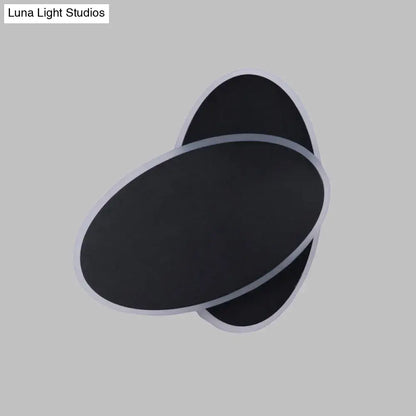 Modern black double oval wall sconce lamp with sleek silver trim for bedside bedroom lighting