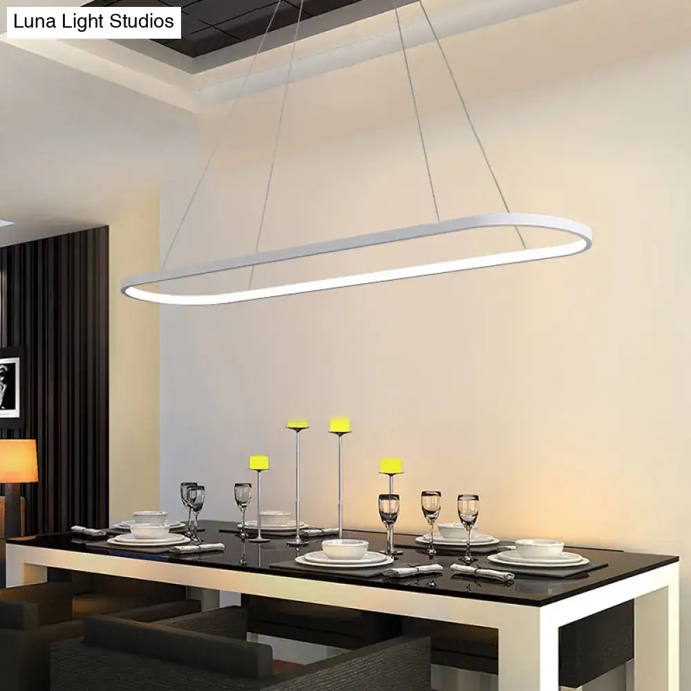Modern white ellipse hanging lamp with sleek minimalist design by decorbites for dining table lighting