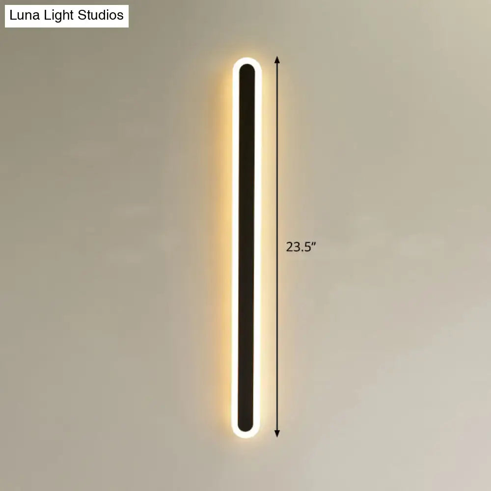 Modern black elliptical acrylic flush wall sconce with a rectangular frame and warm white LED illumination