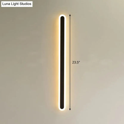Modern black elliptical acrylic flush wall sconce with a rectangular frame and warm white LED illumination