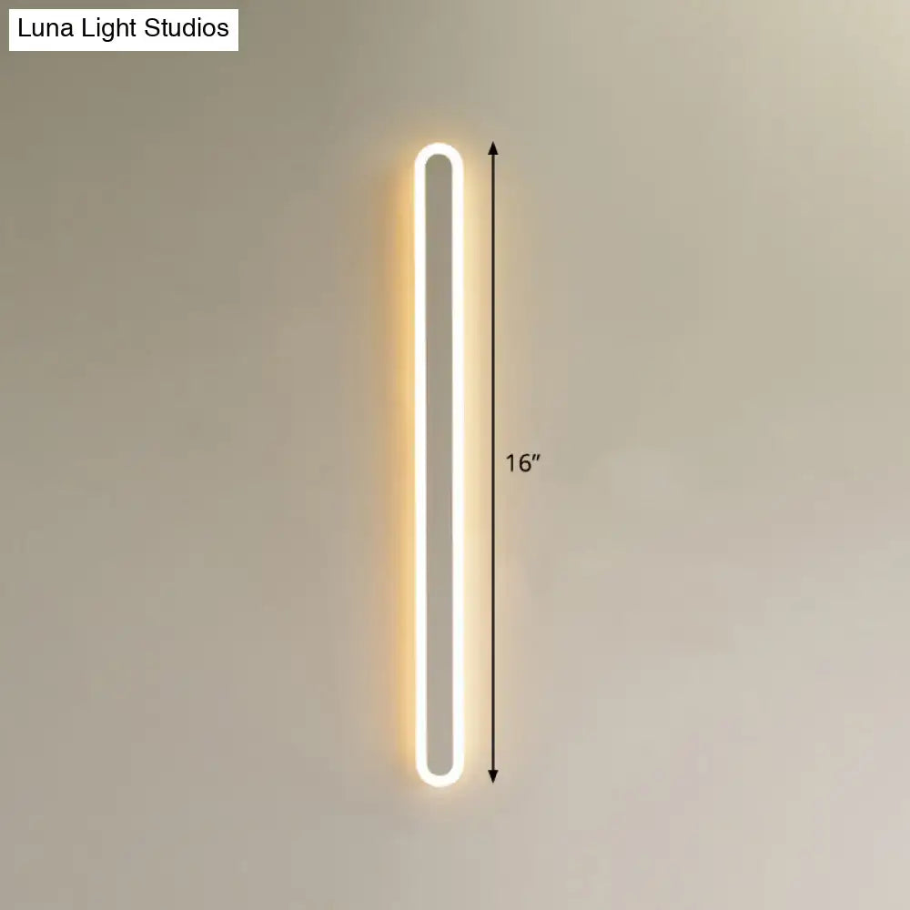 Modern black and white elliptical acrylic wall sconce with warm white led lighting and minimalist oval design, 16 inches tall