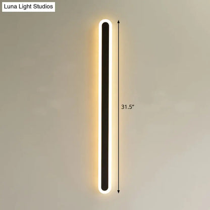 Modern black and white elliptical acrylic wall sconce with a sleek 31.5 inch tall elliptical acrylic flush design and warm white light strip