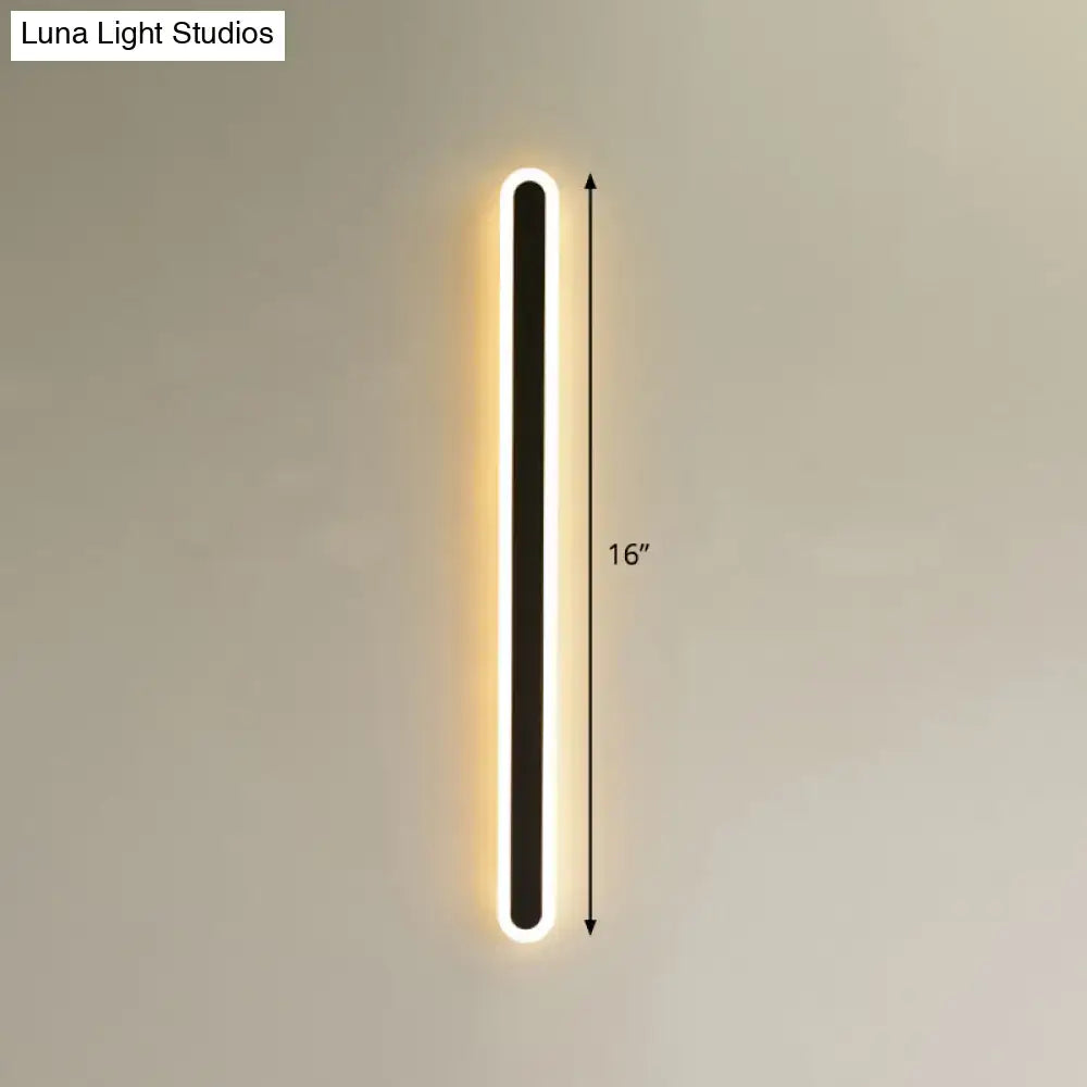 Modern black and white elliptical acrylic wall sconce with black central panel and glowing white led elliptical acrylic flush lighting