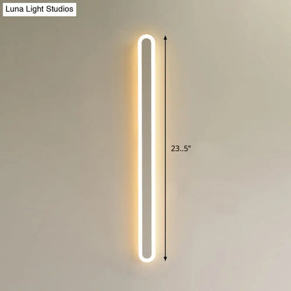 Modern black and white elliptical acrylic wall sconce with warm white led strip in a sleek rectangular frame flush mounted