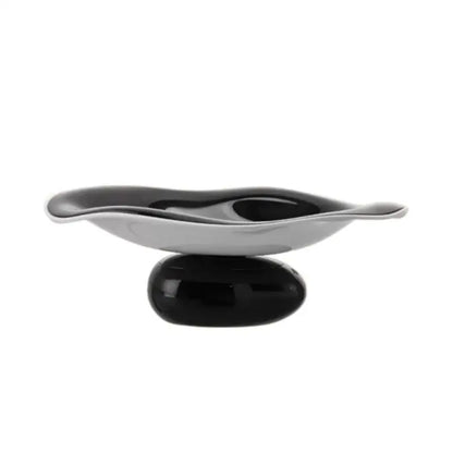 A sleek modern soap dish with a glossy black base and silver wave bowl complementing decorbites geometric acrylic fruit plate