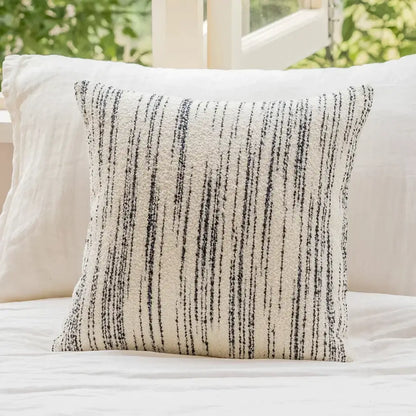 Cream-colored cushion cover with black vertical streaks in decorbites geometric jacquard fabric for living room decor