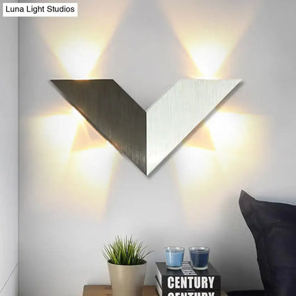Modern black and white geometric metal shade wall lamp with brushed metallic finish and inverted v-shaped panels