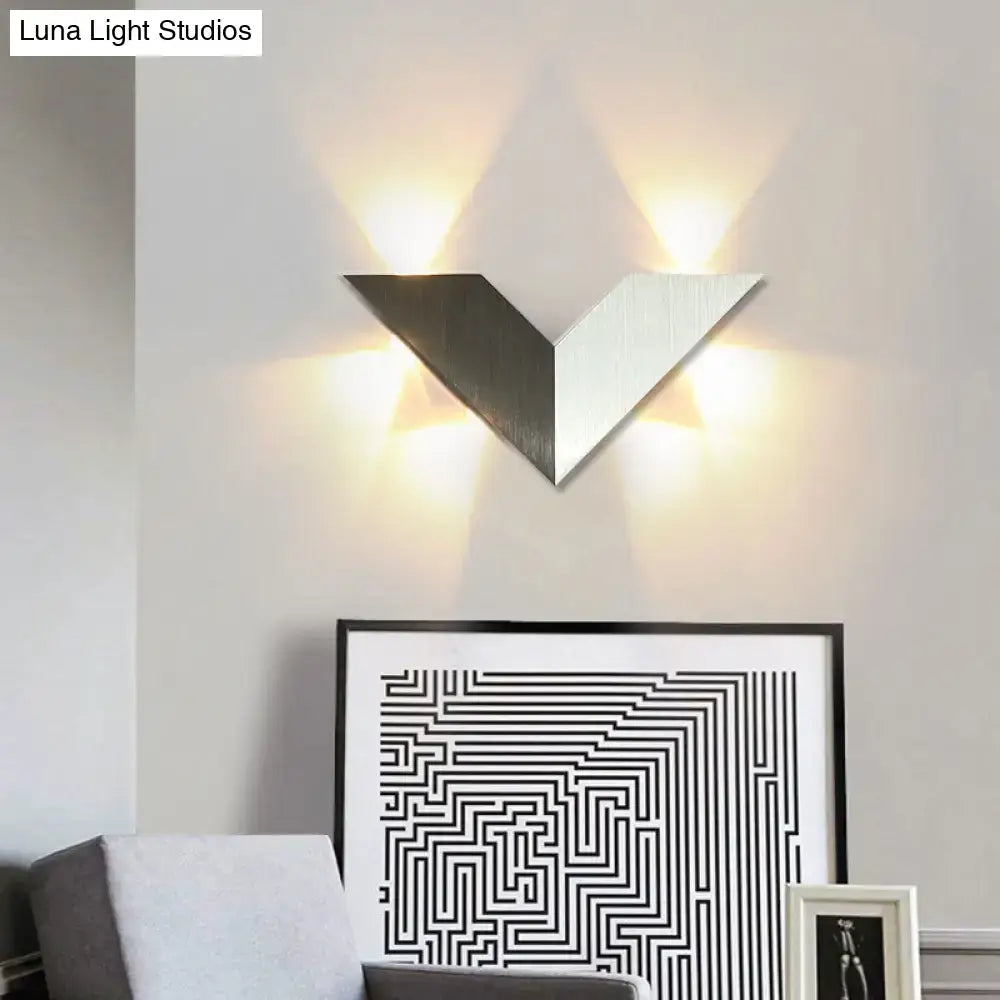 Modern black and white geometric metal shade led wall lamp with v-shaped two-tone metallic panels for bedroom use