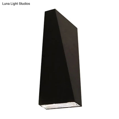 Modern black nord wall sconce with a sleek matte finish designed as a geometric wall lamp for bedroom use