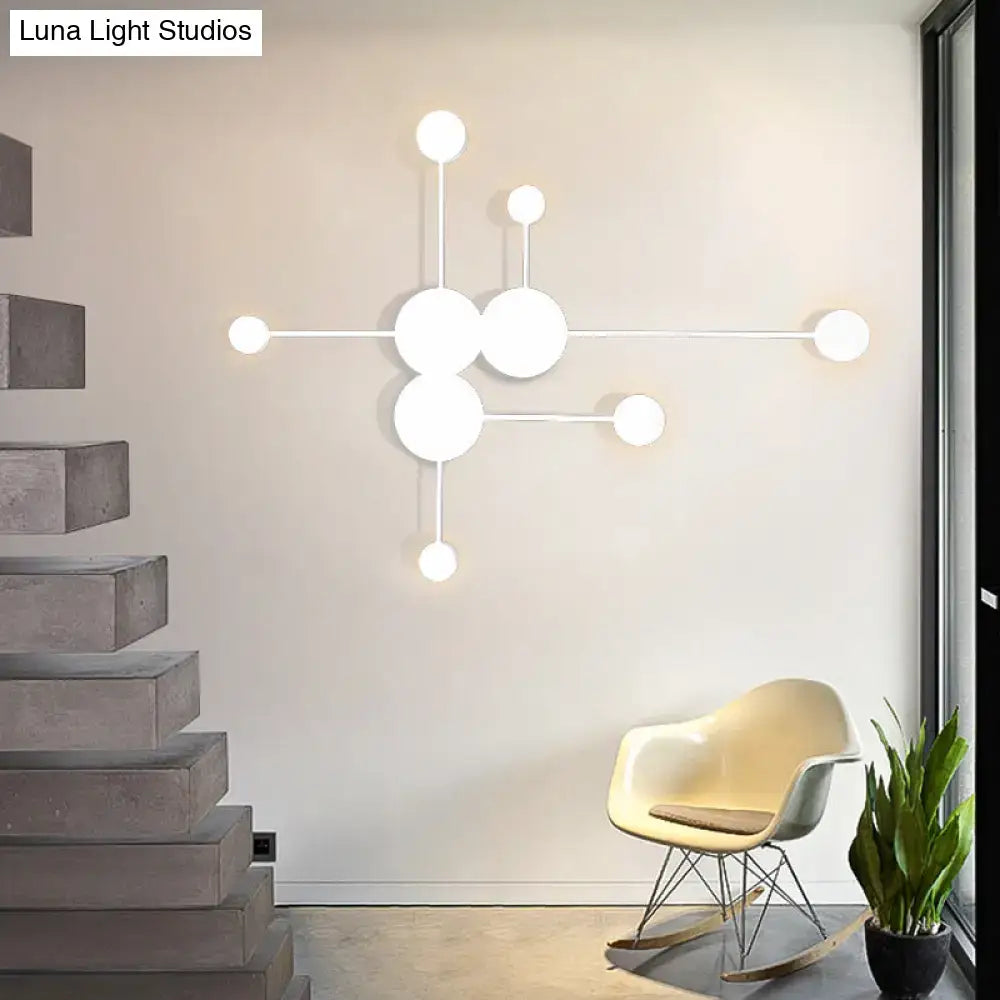 Modern white spherical wall sconce with minimalist geometric design as black and white wall light fixture for living room