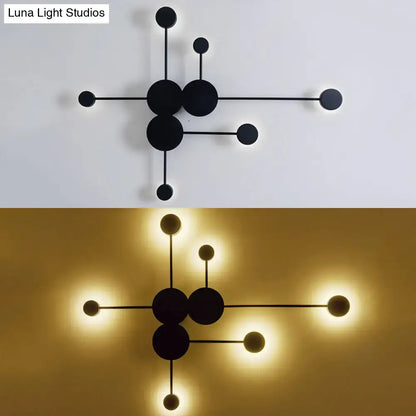 Modern black minimalist wall sconce with geometric molecular design featuring spherical bulbs for living room light fixture