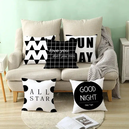 Modern black and white geometry letters cushion cover with black and white geometric patterns for home decor by decorbites black geometry