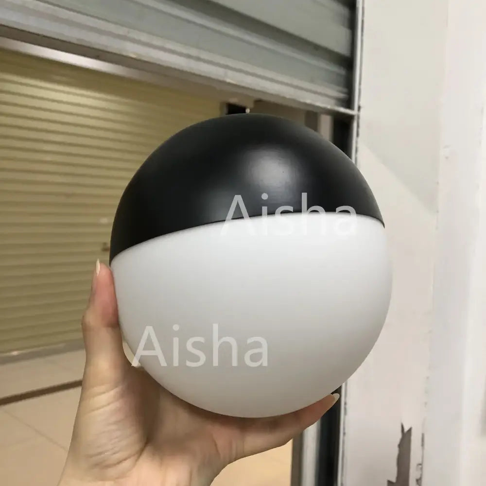 A sleek black and white glass ball pendant light with glossy and matte finishes ideal for modern kitchen decorbites pendant lights